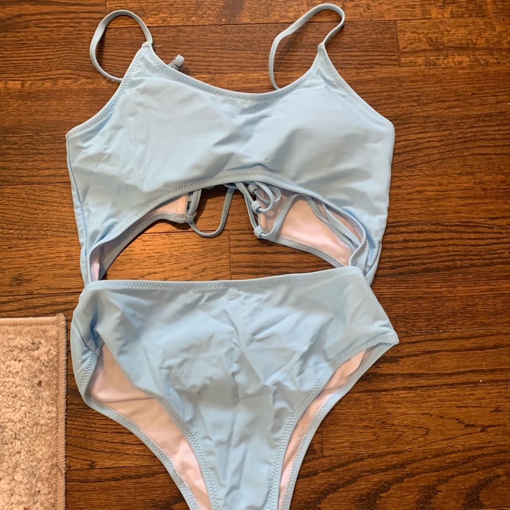 Blue One piece bathing suit with cut out